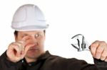 Handyman Wearing Uniform And Hardhat Stock Photo