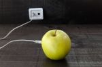 Green Apple Connected To An Ethernet Cable Stock Photo