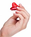 Hand Holding A Condom Stock Photo