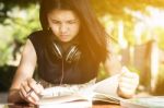 Asian Teen Student Reading Book Preparing For Exam  Stock Photo