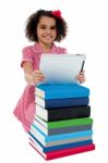 Cute Little Curly Haired Girl Using Tablet Pc Stock Photo