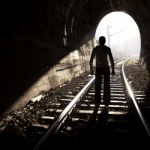 Man Standing In Train Tunnel Stock Photo