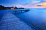 Wood Bridge Pier Into Blue Sea At Morning Time Stock Photo