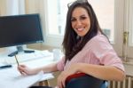 Beautiful Young Woman Working In Her Office Stock Photo