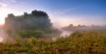 Summer Misty Sunrise On The River. Foggy River In The Morning. P Stock Photo