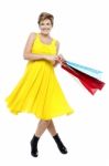 Portrait Of Beautiful Young Woman Carrying Shopping Bags Stock Photo