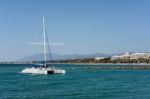 Catamaran Entering The Harbour In Marbella Stock Photo