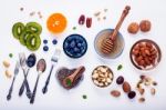 Ingredients For A Healthy Foods Background, Nuts, Honey, Berries Stock Photo