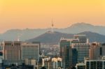 View Of Seoul Tower And Cityscape With Golden Light In Seoul, South Korea Stock Photo