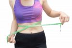 Woman In Sport Bra Measuring Her Body With Tape Isolated On Whit Stock Photo