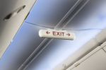 Airplane Cabin Interior Exit Sign Stock Photo