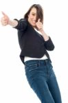 Excited Woman Showing Thumbs Up Gesture Stock Photo