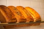 Freshly Kneaded Grain And White Breads For Sale Stock Photo