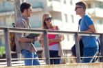 A Group Of Friends Talking In The Street After Class Stock Photo