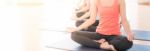 Asian Woman Doing Yoga Indoors Stock Photo