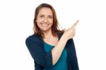 Joyous Smart Woman Pointing Away Stock Photo