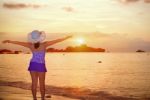 Visitors Woman Looking The Sunrise Over The Sea Stock Photo