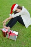 Santa Claus Hat With Red Christmas Gift Box Stock Photo