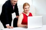 female Boss Working With PA Stock Photo