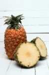 Fresh Azores Pineapple Fruit Isolated On A White Wooden Background Stock Photo