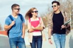 A Group Of Friends Talking In The Street After Class Stock Photo