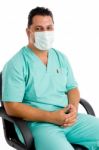 Surgeon sitting With Face Mask Stock Photo