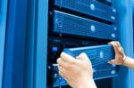 Man Fix Server Network In Data Center Room Stock Photo