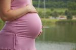 Pregnant Woman Holding Belly Stock Photo