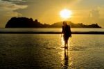 Girls On The Beach During Sunrise Stock Photo