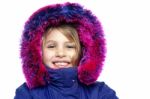 Cheerful Young Girl In Hooded Fur Jacket Stock Photo