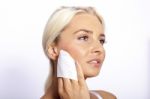 Young Woman Clean Face With Wet Wipes Stock Photo