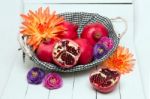 Fresh Pomegranate Fruits Isolated On A White Wooden Background Stock Photo