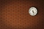 Clock On Brick Wall Stock Photo