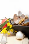 Fresh Clams On An Iron Skillet Stock Photo