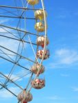 Ferris Wheel Against The Blue Sky Stock Photo