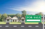 Home For Sale With Green For Sale Sign Stock Photo