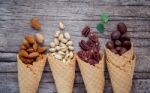 Concept For Homemade Various Nuts Ice Cream. Mixed Nuts In Waffl Stock Photo