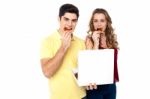 Couple Enjoying Pizza Slices Stock Photo