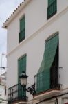 Marbella, Andalucia/spain - July 6 : Green Blinds Over Balconies Stock Photo