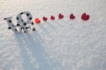 Red Hearts On White Snow Stock Photo