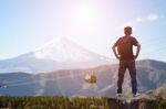 Backpacker Standing On The Rock Stock Photo