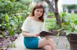 Portrait Of Thai Adult Businesswoman Beautiful Girl Using Her Tablet Stock Photo