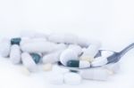 Pills And Tablets On Spoon Stock Photo