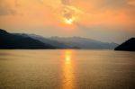 Sunset Over A Mountain At Lake Stock Photo