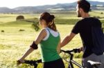 Happy Young  Couple On A Bike Ride In The Countryside Stock Photo