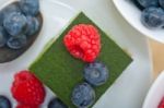 Green Tea Matcha Mousse Cake With Berries Stock Photo