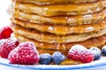 Pile Of Pancakes With Blueberries And Raspberries Sprinkled With Stock Photo