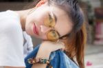 Portrait Of Thai Chinese Adult Glasses Beautiful Girl Denim Blue Bag Relax And Smile Stock Photo