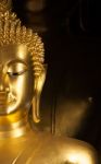 Golden Buddhist Statue Face Stock Photo