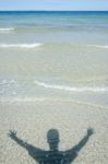 Shadow Man On Beach Stock Photo